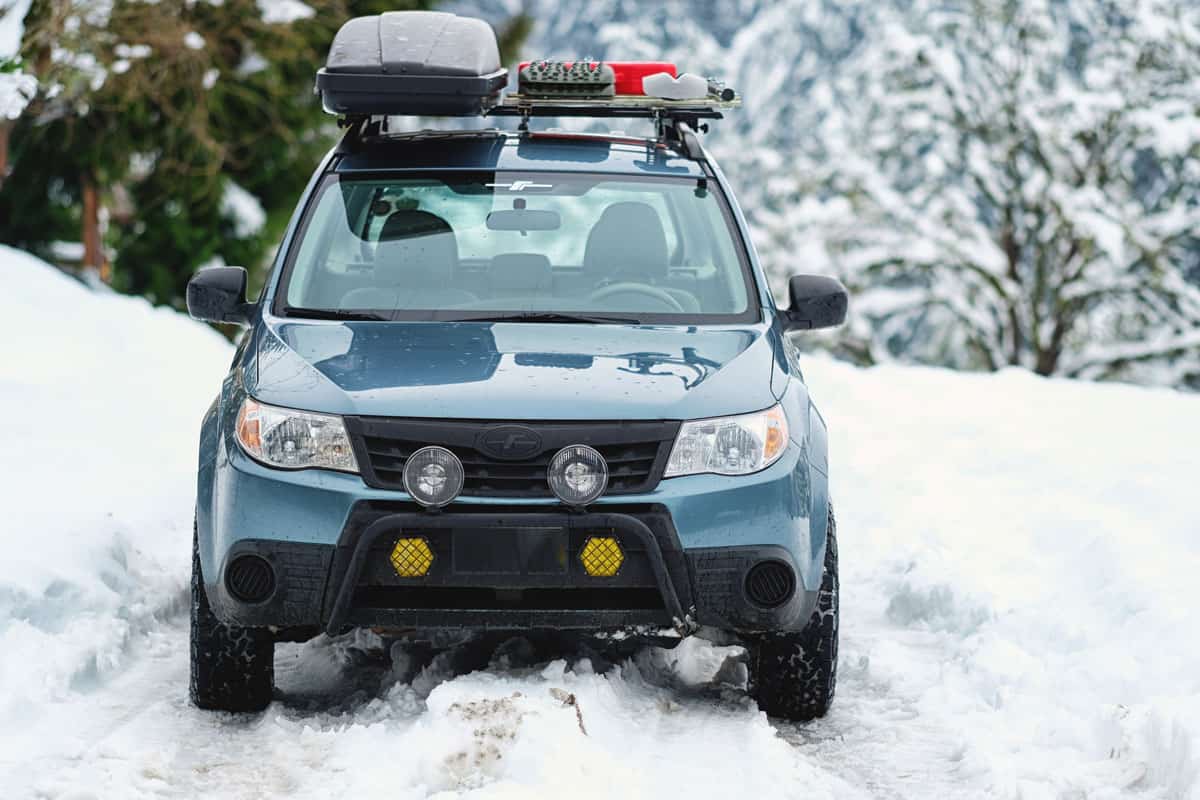  A Subaru Forester modified for offroad use on a snowy country lane