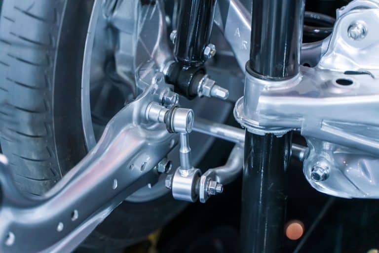 A car front axle photographed up close, What Are The Symptoms Of A Broken Front Axle?