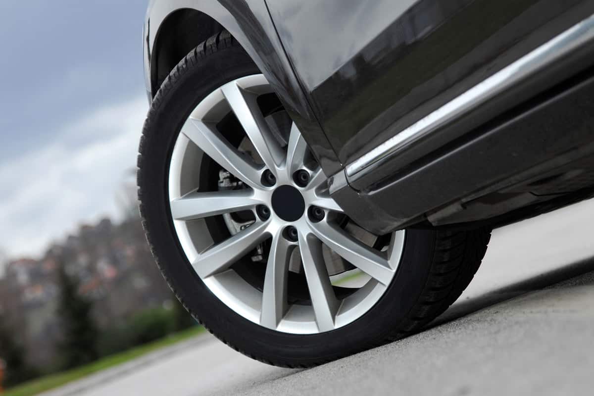 A detailed photo of a car wheel turning left