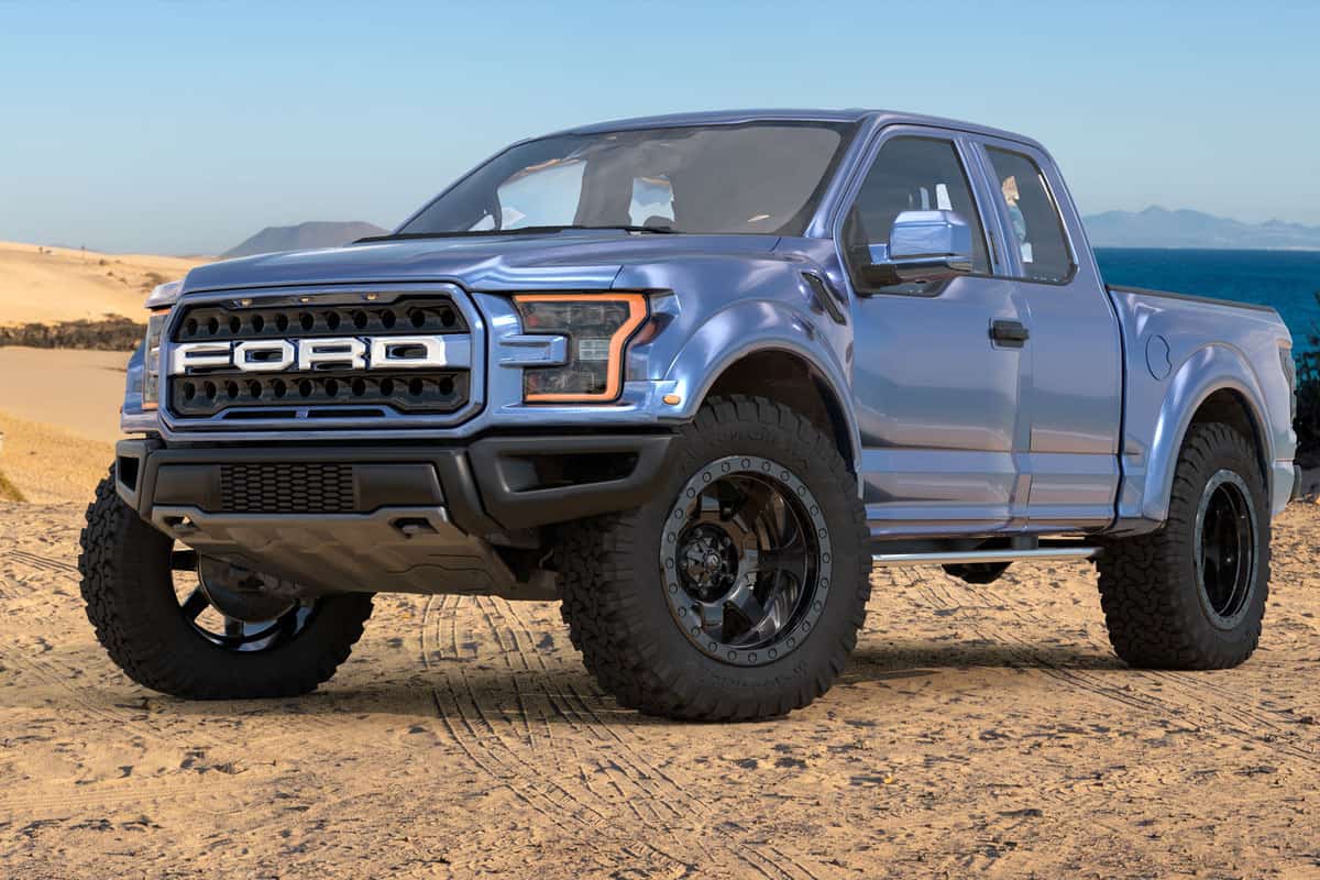 A light gray painted Ford F150 on the dessert