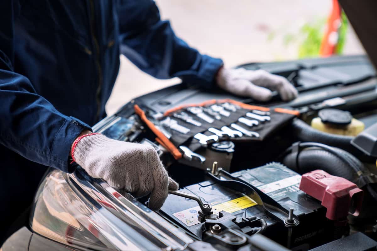 Auto mechanic working in the garage, Service and maintenance and car maintenance. 