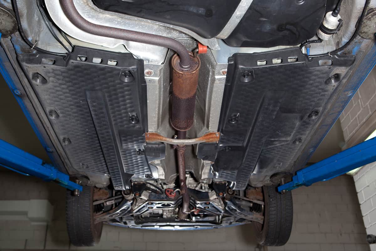 Auto repair shop - low-angle view of a car, exhaust system