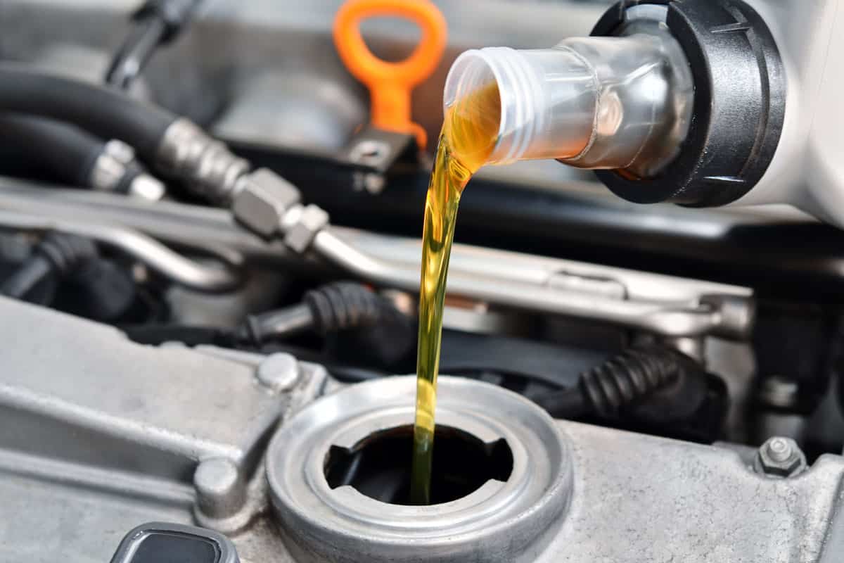Car Engine refilling new engine oil