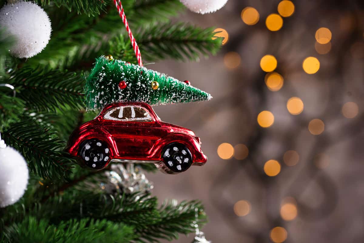 Christmas background with tree toy in shape of red car