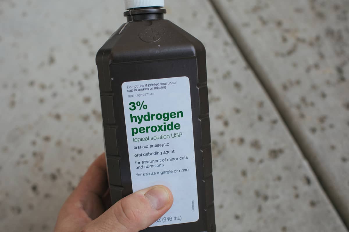 Closeup of 3% Hydrogen Peroxide, topical solution USP in a brown bottle.