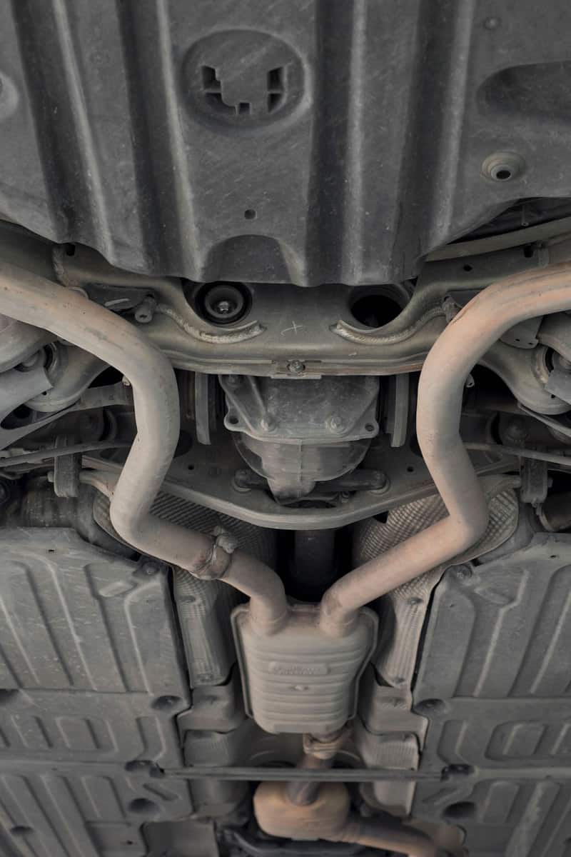 Exhaust manifold of a car showing the catalytic converter