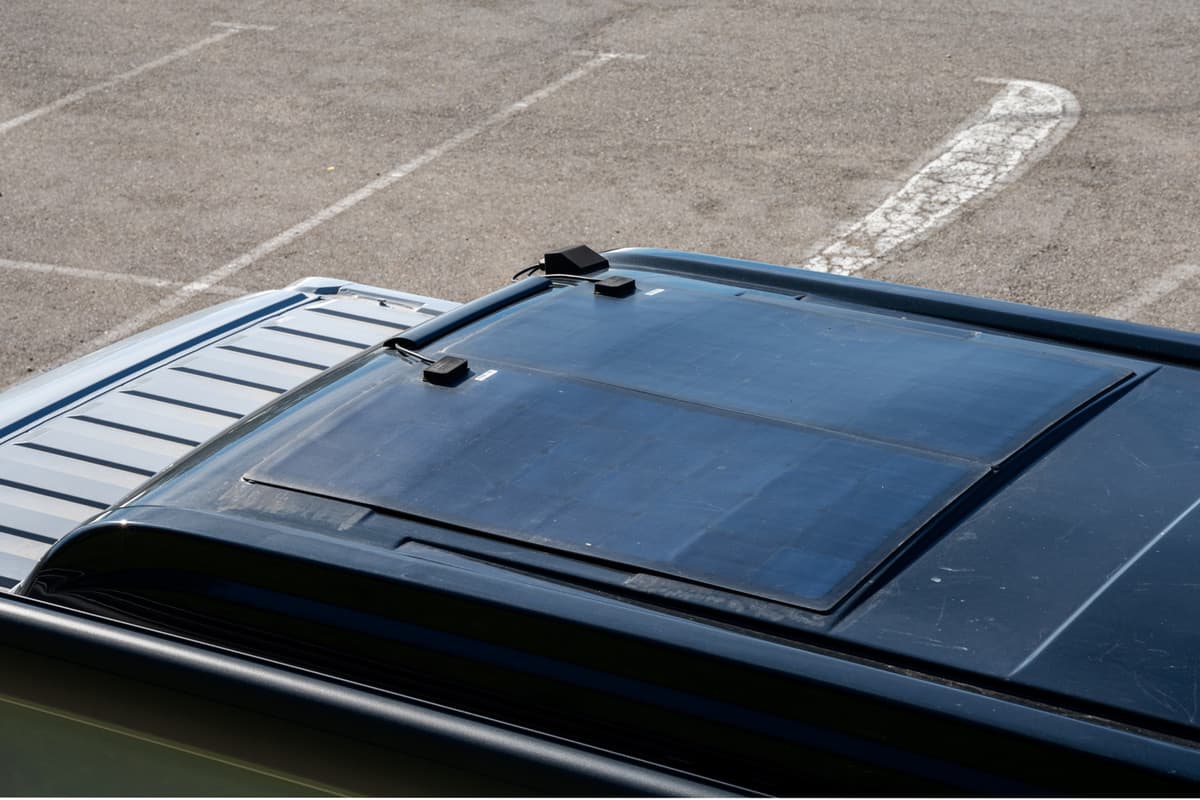 High angle view of the pop-top roof of a camper van with felxible solar panels installed