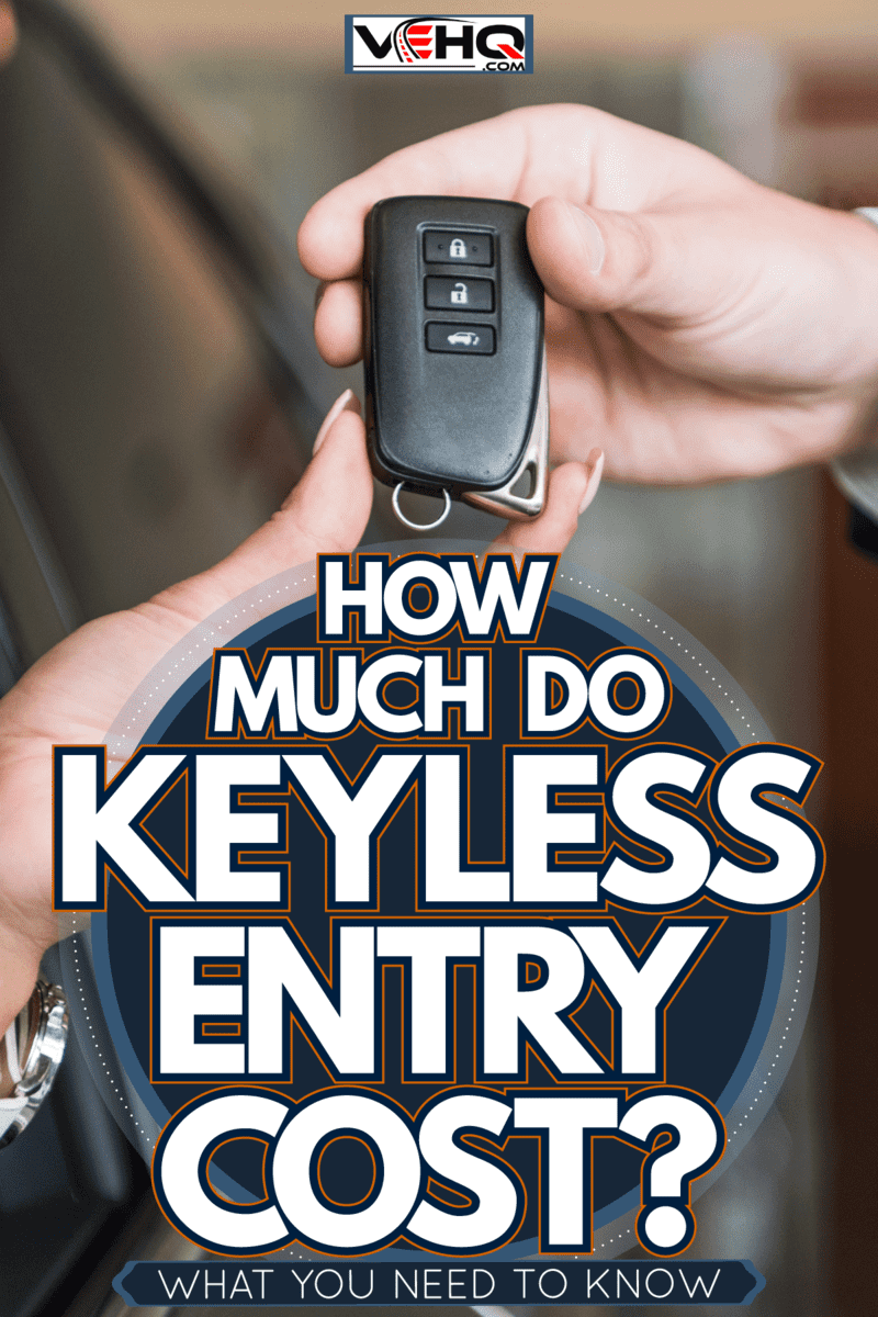 Dealership owner giving the car keys to the new car owner, How Much Do Keyless Entry Keys Cost? [What You Need To Know]