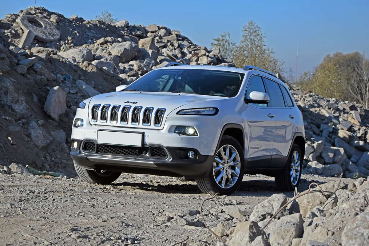 Jeep Cherokee parked on the rocks. This model is one of the most popular SUV vehicles from Jeep.