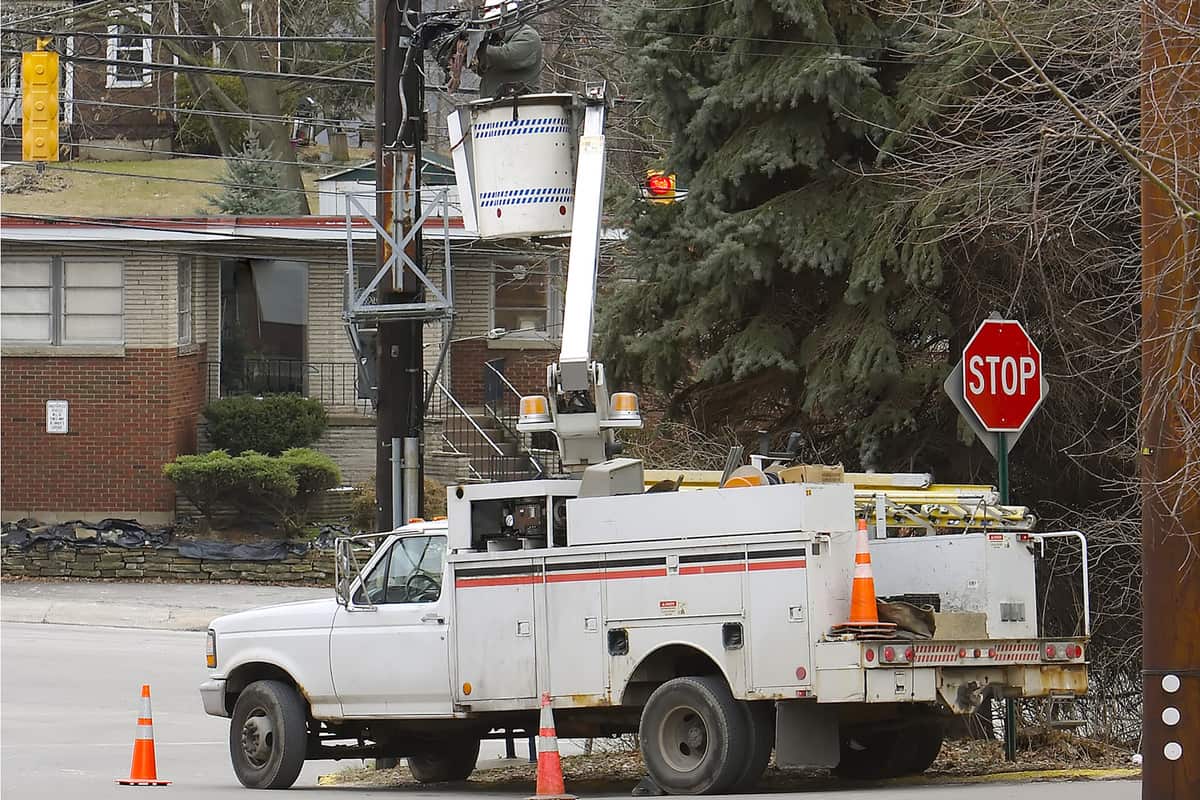 Man Working on Power or Communication Lines from Bucket Truck