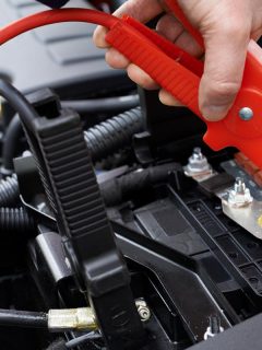 A mechanic attaching jumper cables to car battery, Can You Jump Start A Car With A Bad Starter?