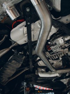 Under side of a car showing the titanium exhaust pipe, Glasspacks Vs Straight Pipe: What Are The Differences?