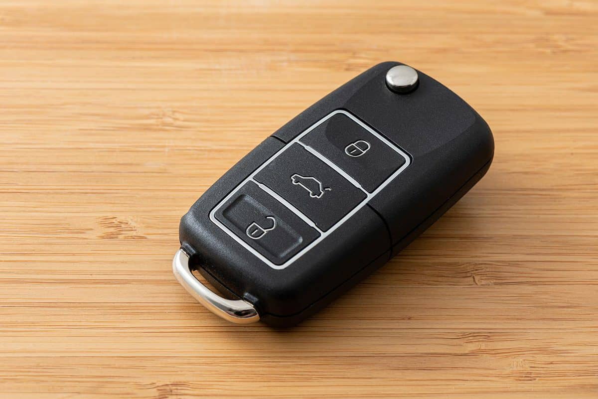 Wireless car key on the wooden table