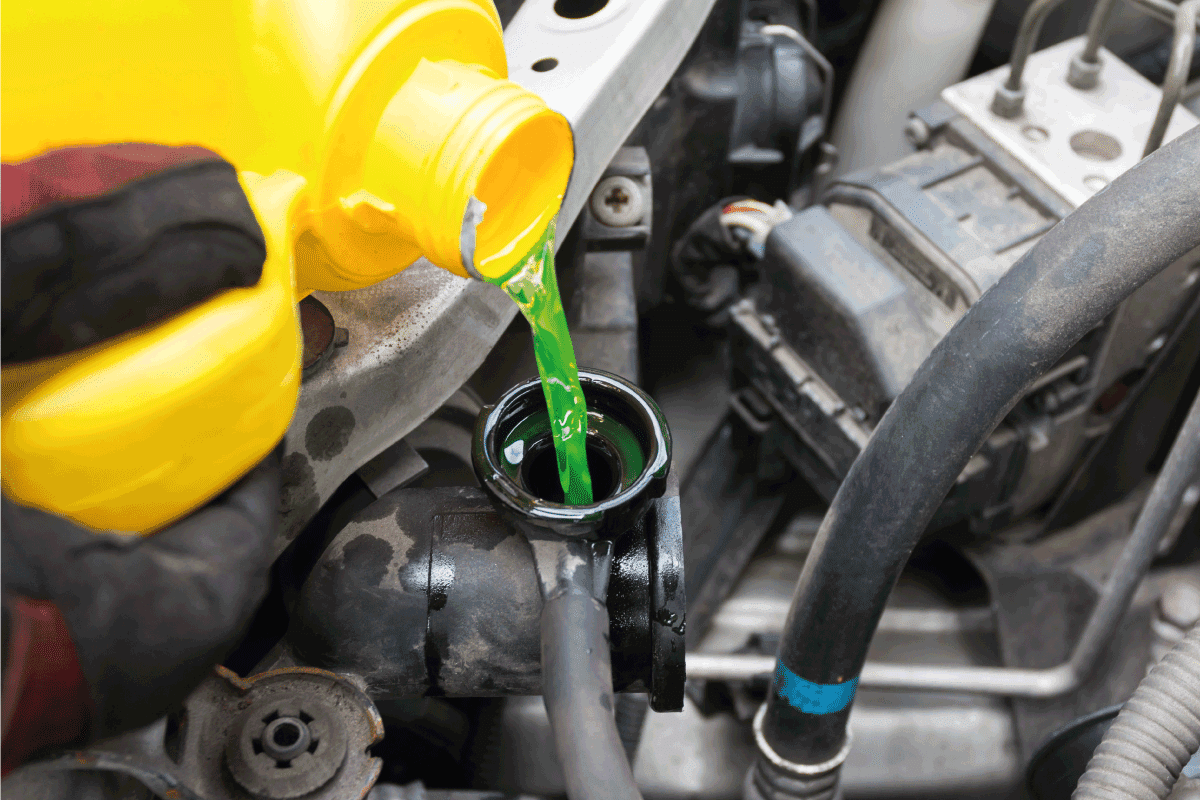 pouring coolant from yellow jug into car reservoir. What Color Coolant Does Nissan Use