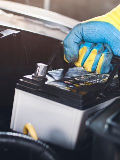 pulling up an car old battery for replacement, Can A Bad Car Battery Cause Computer Problems?
