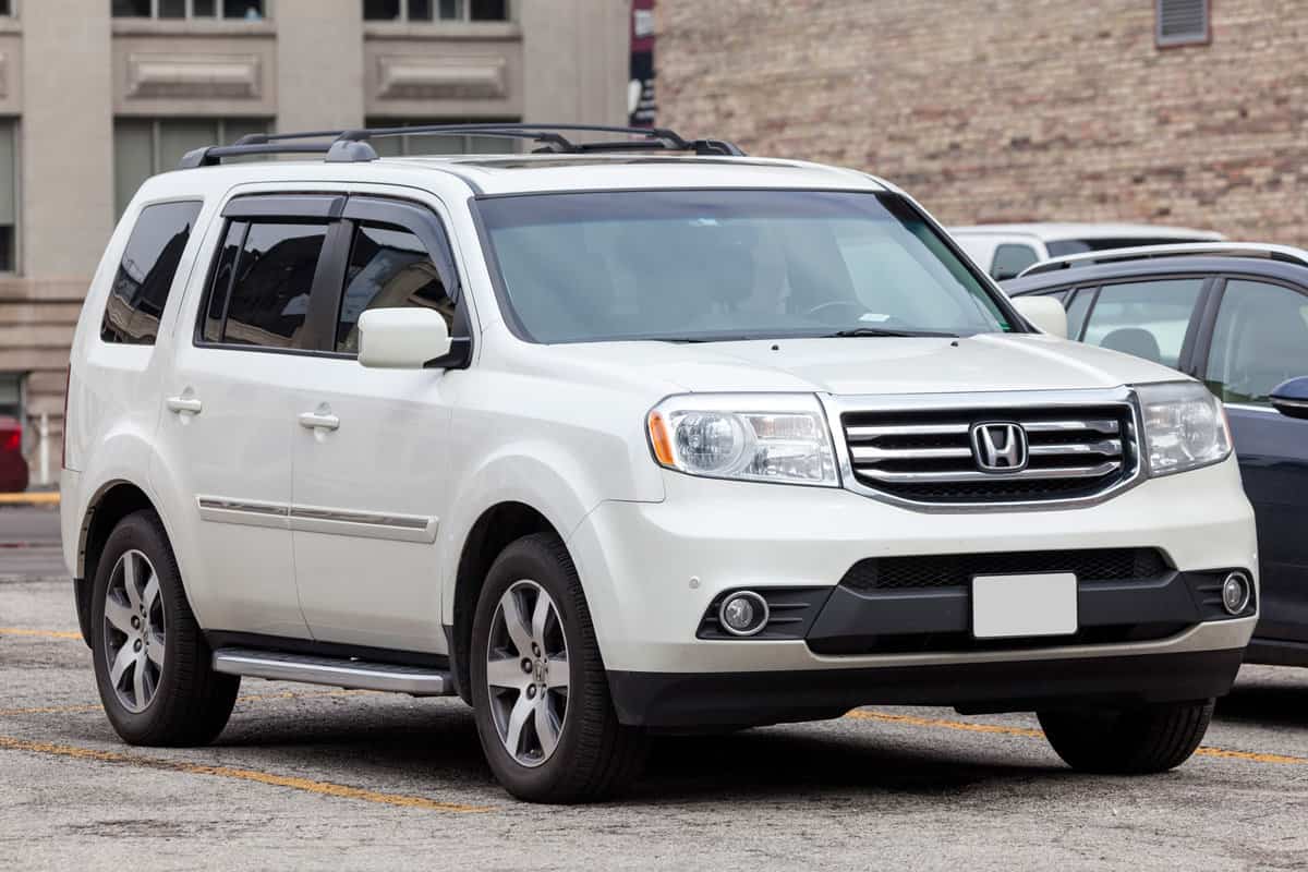  2012 model of the Honda Pilot family SUV parked in the city of Toronto