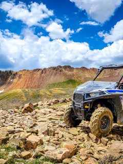 4x4 Side-by-Side off-road vehicle, UTV ATV with a beautiful mountain range, 11 Awesome 4 Door Side-By-Sides
