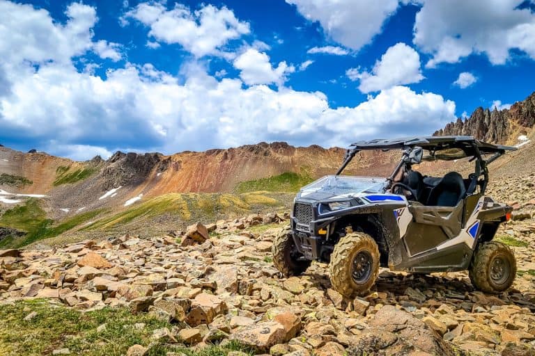 4x4 Side-by-Side off-road vehicle, UTV ATV with a beautiful mountain range, 11 Awesome 4 Door Side-By-Sides