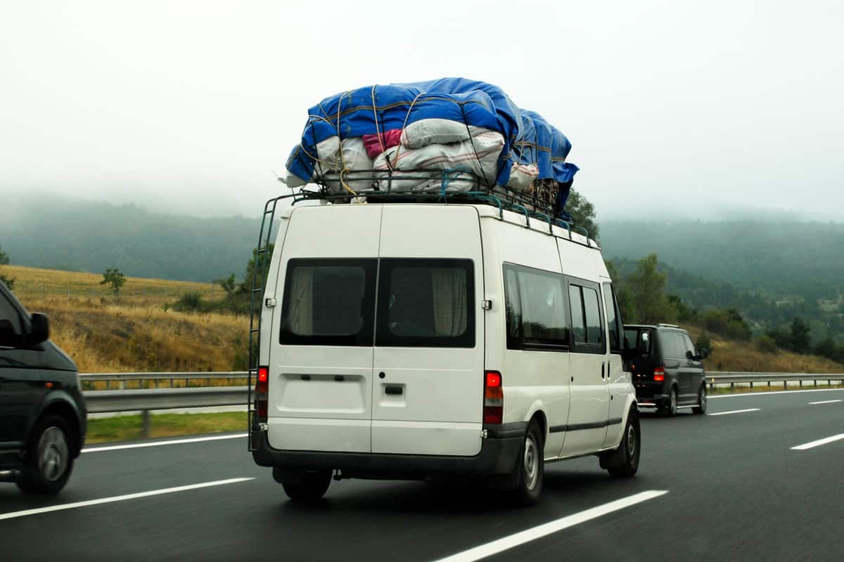 A Mercedes Sprinter van moving down the highway