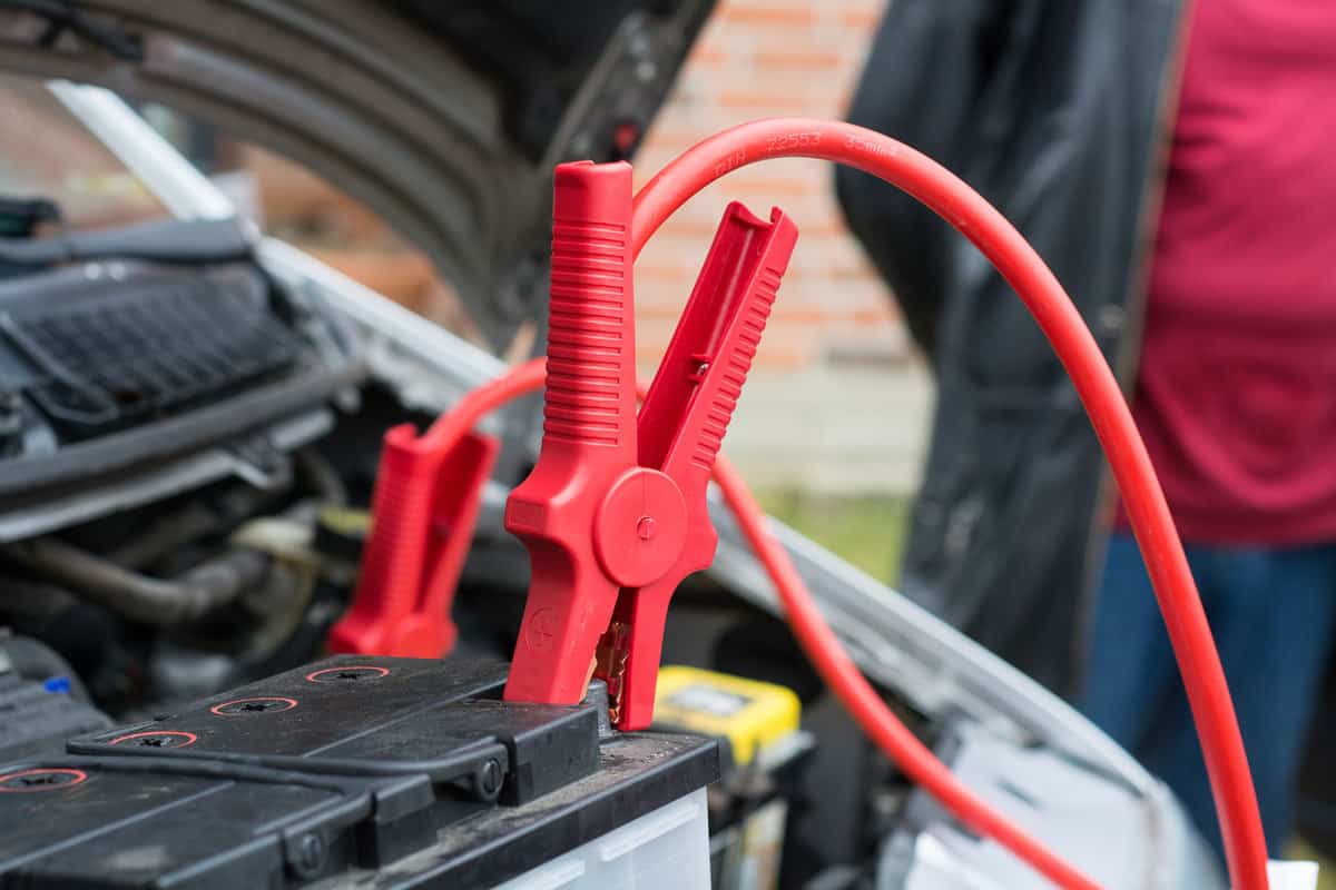 Alligator clips clipped to a car battery