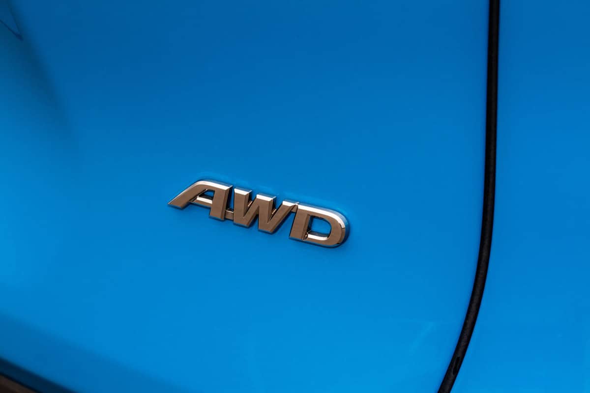 An AWD emblem on the back of a SUV