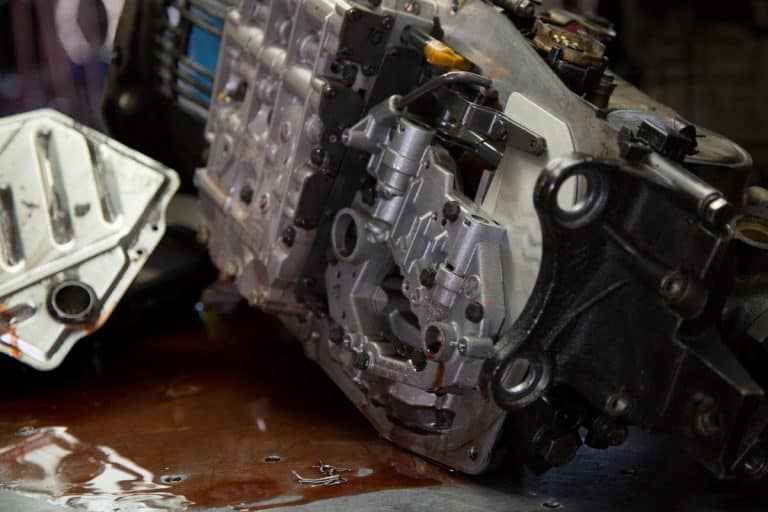 An auto car transmission parts being worked on in an auto mechanic shop, Can Transmission Fluid Freeze? [And What To Do About It]