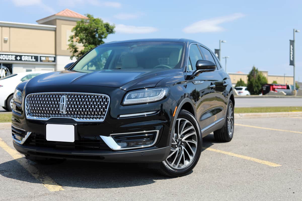 Brand new shiny Lincoln Nautilus 2019 Reserve in black color on an outdoor parking lot
