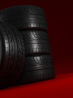 Car wheels set on red background, Can You Put Wider Tires On Stock Rims?
