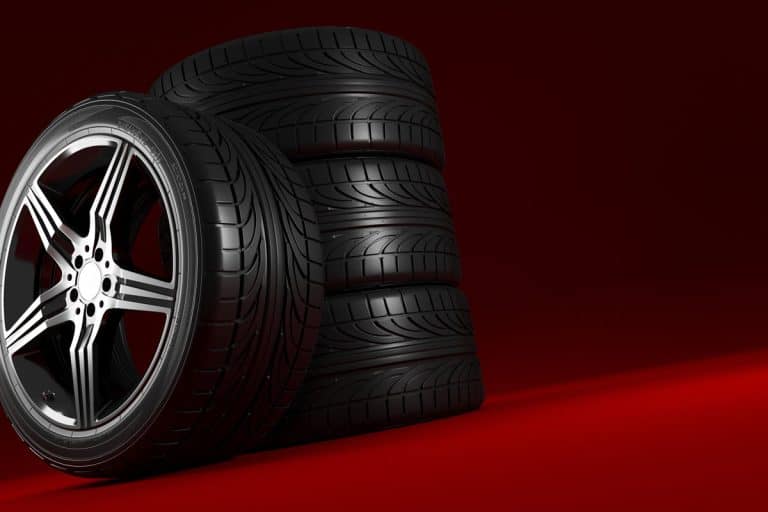 Car wheels set on red background, Can You Put Wider Tires On Stock Rims?