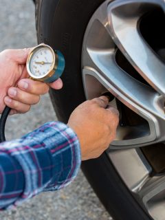 Checking tire pressure with pressure gauge - What Tire Pressure Is Too High