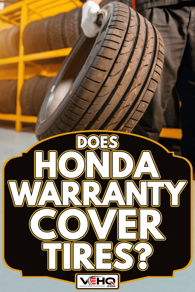 A male tire changer In the process of checking the condition of new tires, Does Honda Warranty Cover Tires?