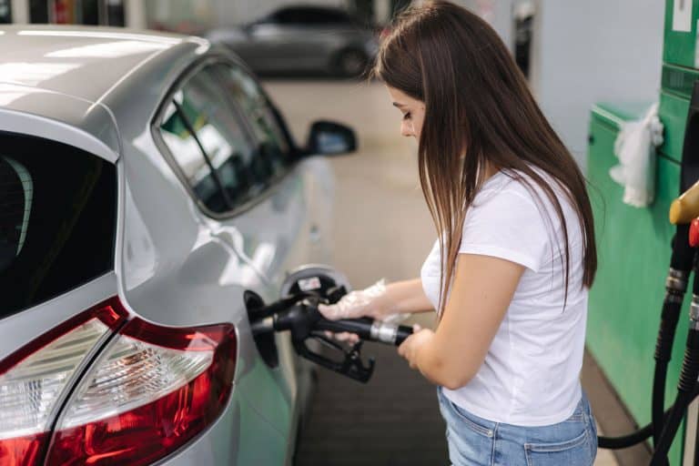 Female filling diesel at gasoline fuel in car using a fuel nozzle, Can You Refuel With Car Engine Running?