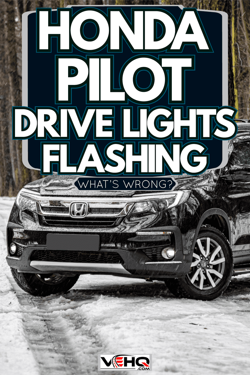 A black Honda Pilot parked on a snowy road, Honda Pilot Drive Light Flashing - What's Wrong?