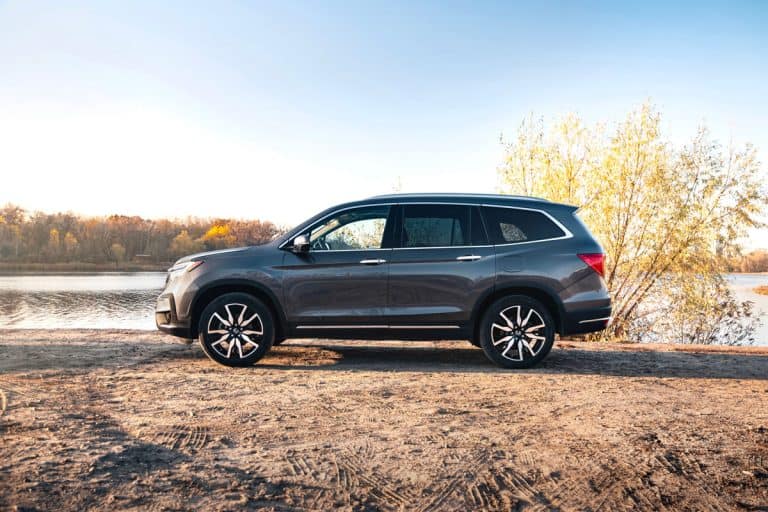 Honda Pilot Touring 2019 in a gary color near the river on a sunny day, Honda Pilot Won't Stop Honking - What To Do?