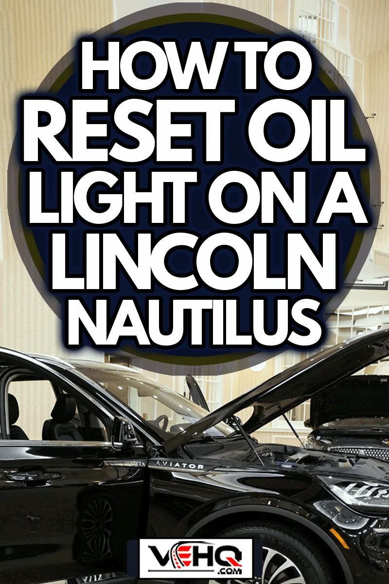 The open front hood of a shiny black color of 2019 Lincoln Nautilus Midsize Luxury Crossover, How To Reset Oil Light On A Lincoln Nautilus