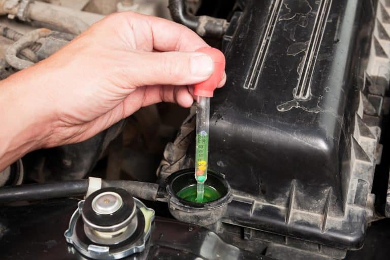 A mechanic testing vehicle radiator antifreeze protection level, Why Is Coolant Reservoir Boiling But Engine Not Overheating?
