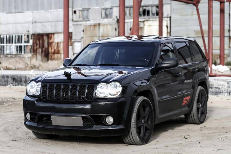 An off-road car Jeep Grand Cherokee SRT-8 in the industrial area, What Are The Biggest Tires For A Stock Jeep Grand Cherokee?