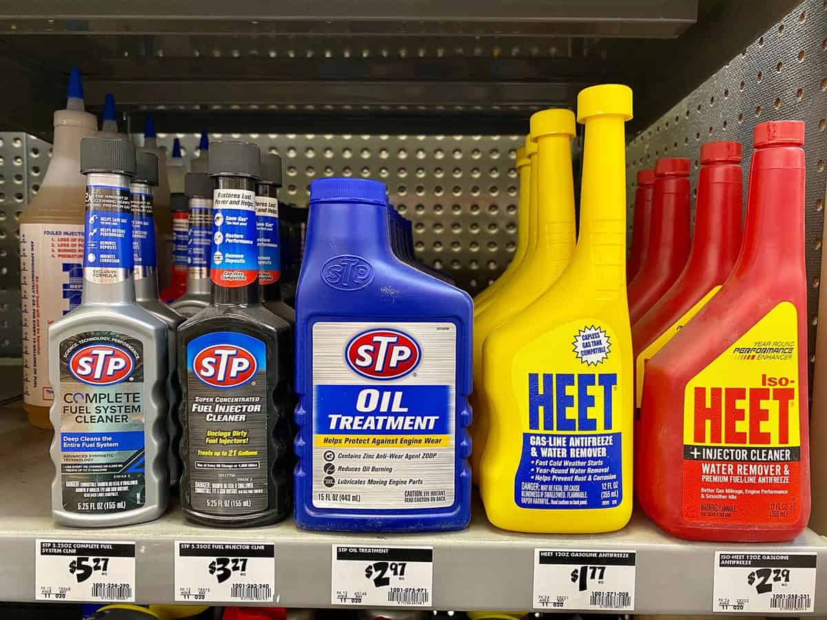 Oil and fuel system treatment bottles of additive inside a home depot car maintenance