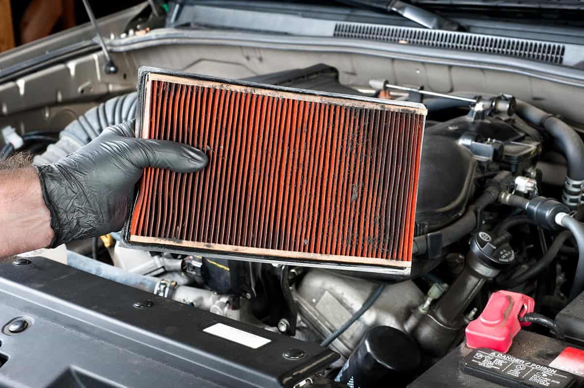 Removing a dirty automotive air filter
