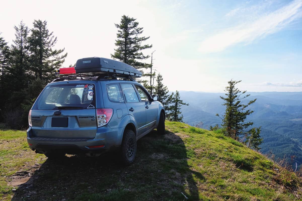 Subaru Forester parked near a cliff for a scenic view
