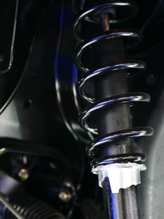 Up close photo of a car suspension, Car Feels Bouncy And Loose When Driving—What To Do?