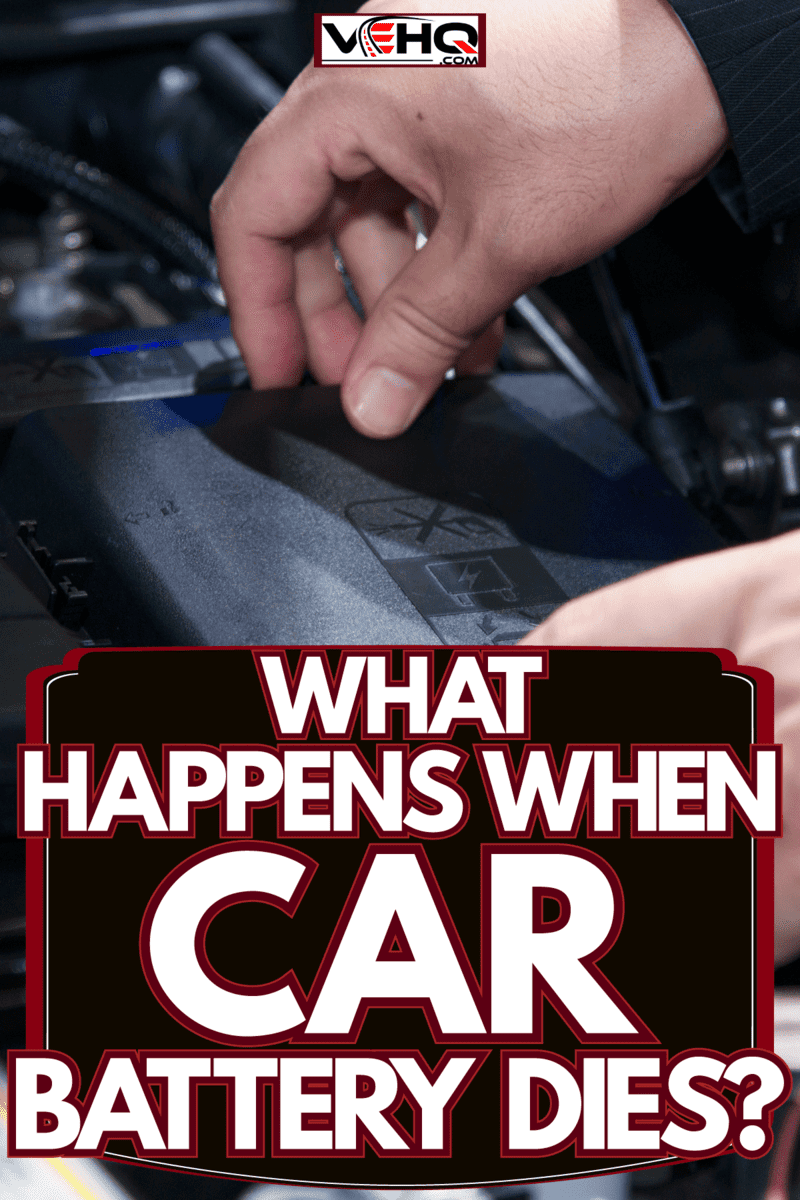 Technician removing the battery to check for any damages or leaks, What Happens When Car Battery Dies?