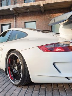 White sports car with huge spoiler installed at the back, Can You Add A Spoiler To Any Car [And Should You?]