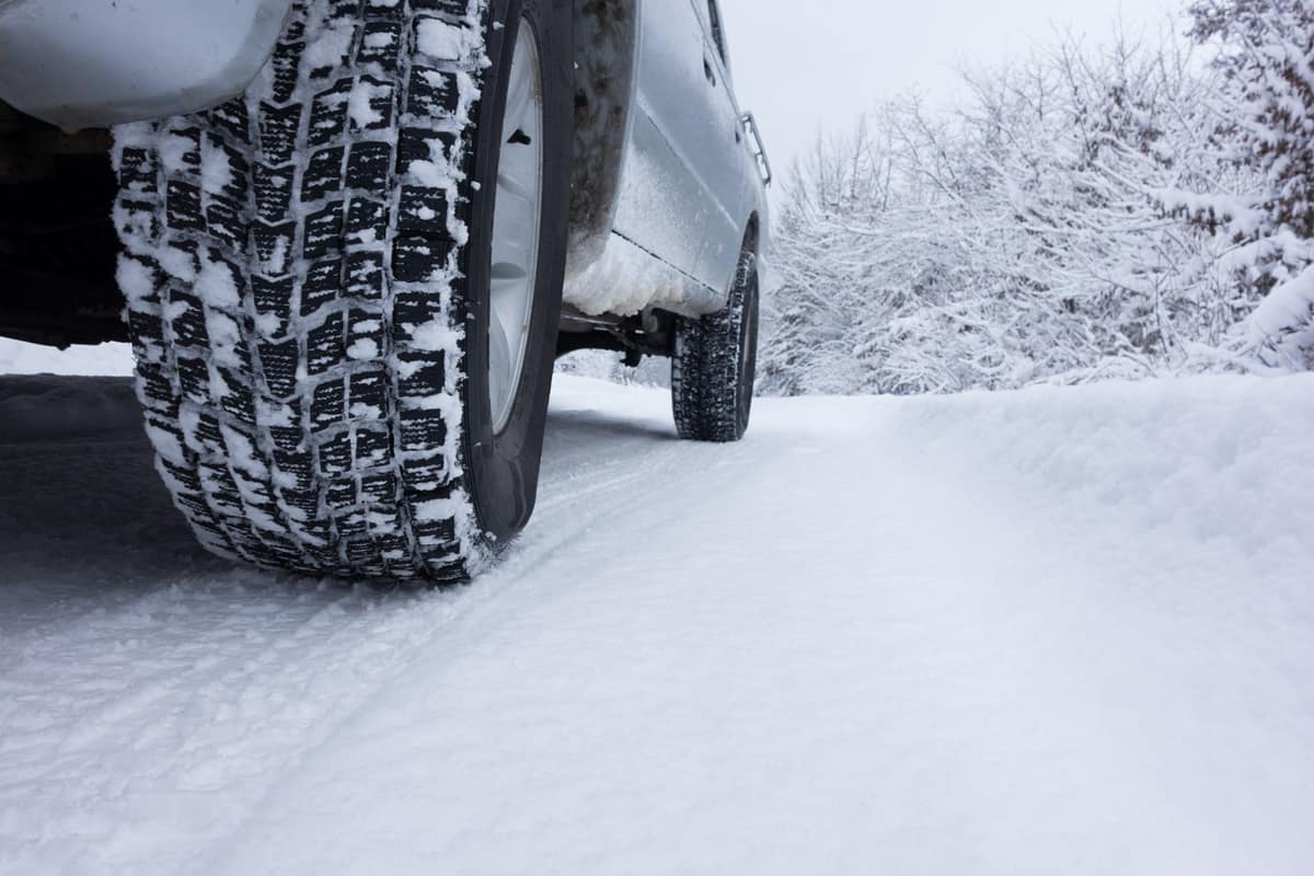 Winter Tyre on snow covered road.