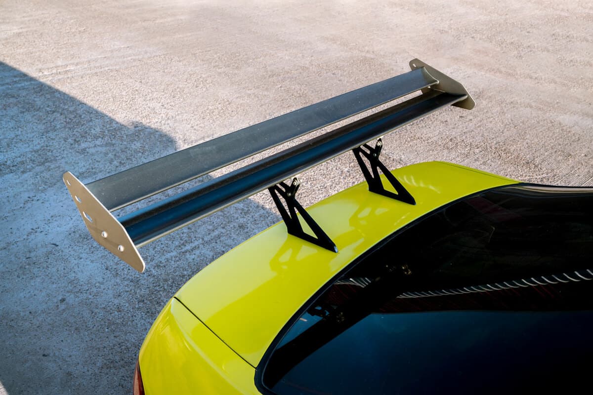 double blade spoiler in a yellow sports car
