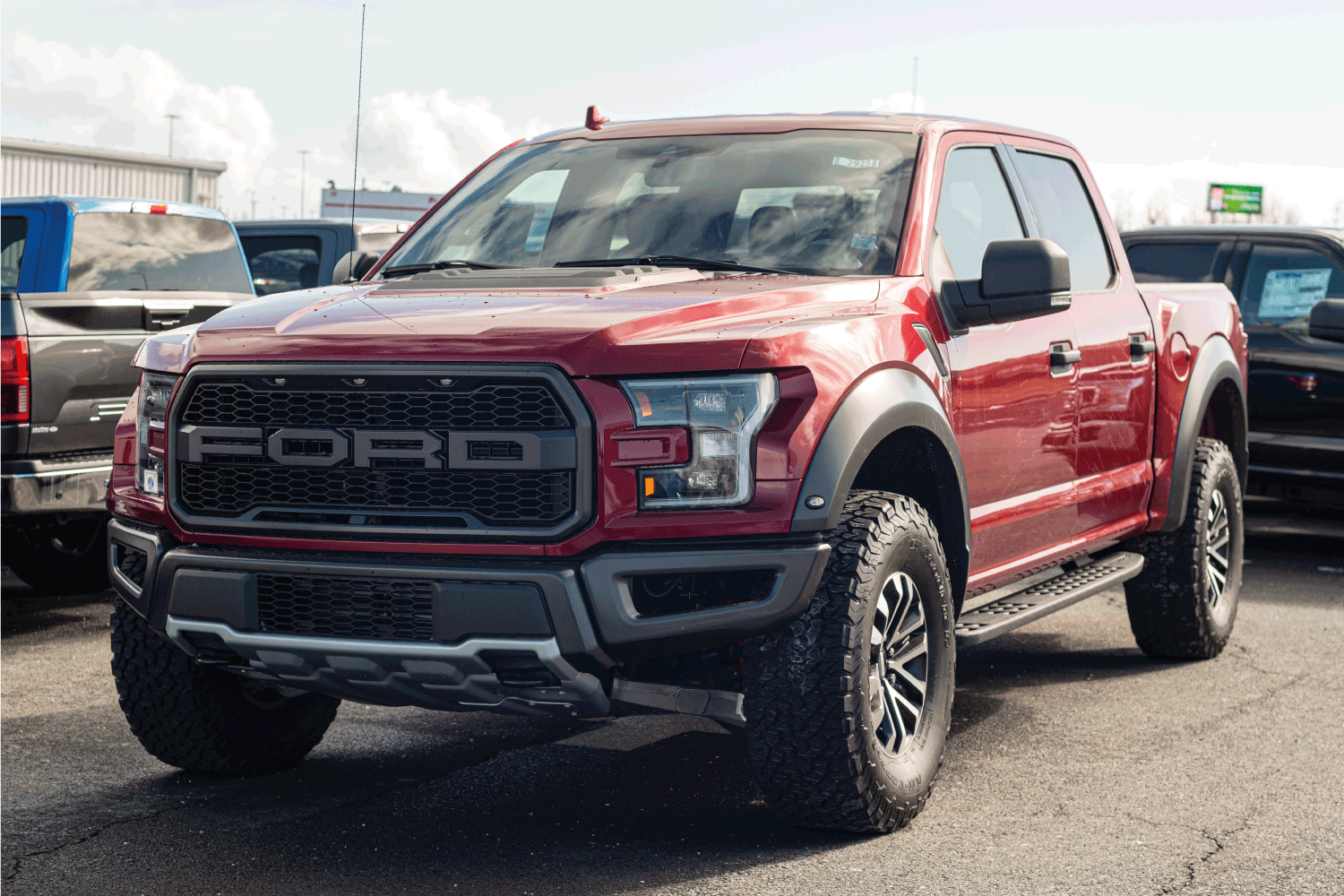 2020 Ford F-150 Raptor pickup truck at a Ford dealership.