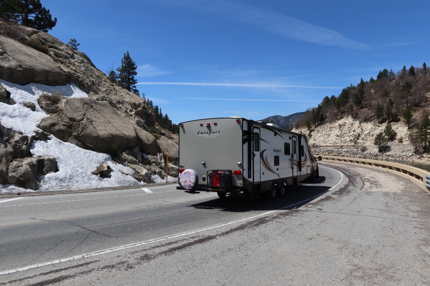 A Fifth 5th Wheel Recreational travel Trailer on a Mountain Road Looking for Adventure and a Place to camp