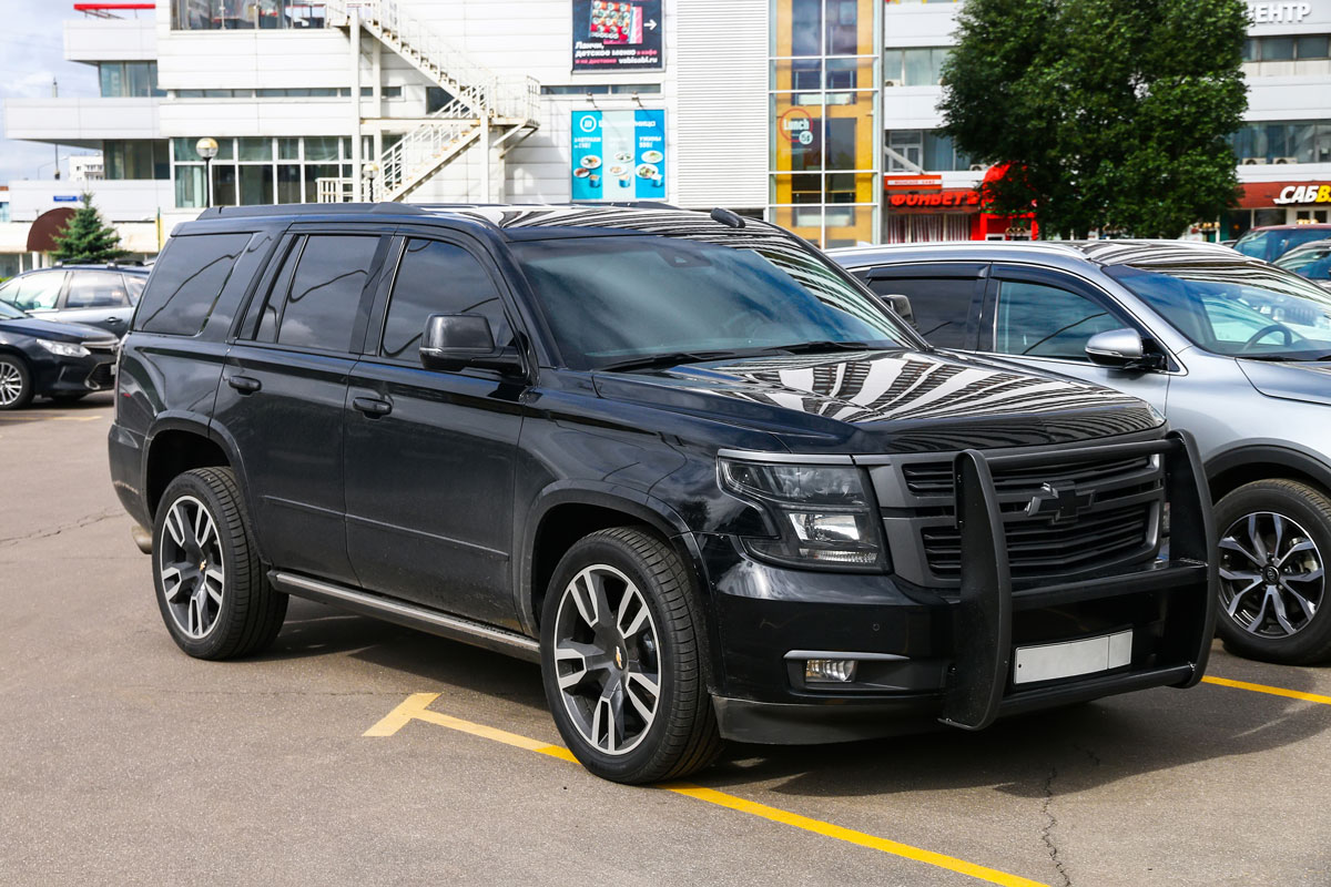 A black colored Chevrolet Suburban photographed at the parking lot