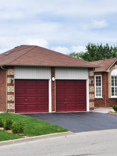 A brick house with red colored garage door, Merlin Garage Door Not Closing - What To Do?