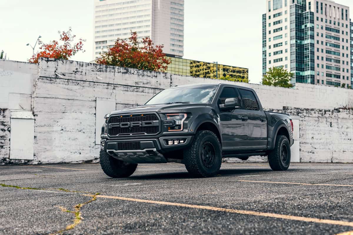 A huge manly black Ford F-150 photographed at a parking lot